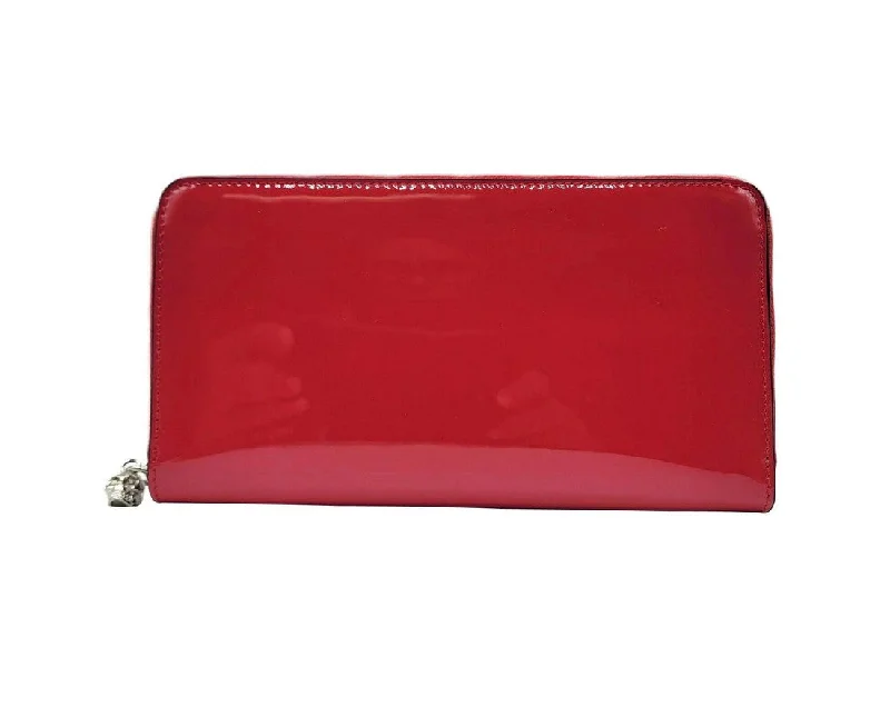 Women's money clip with a leather - wrapped metal core​Alexander McQueen Women's  Patent Leather Skull Zip Around Wallet