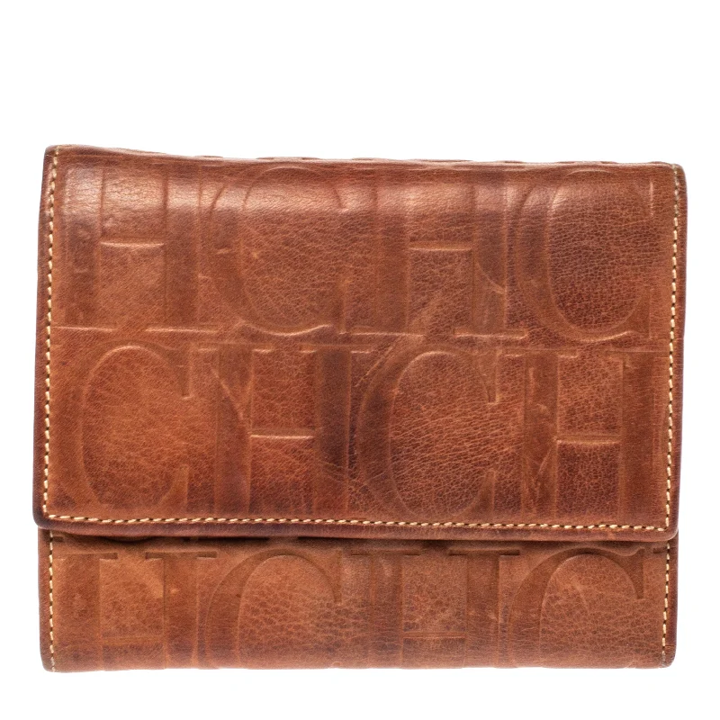 Women's money clip with a swarovski crystal accent​Carolina Herrera Brown Embossed Leather Trifold Compact Wallet..