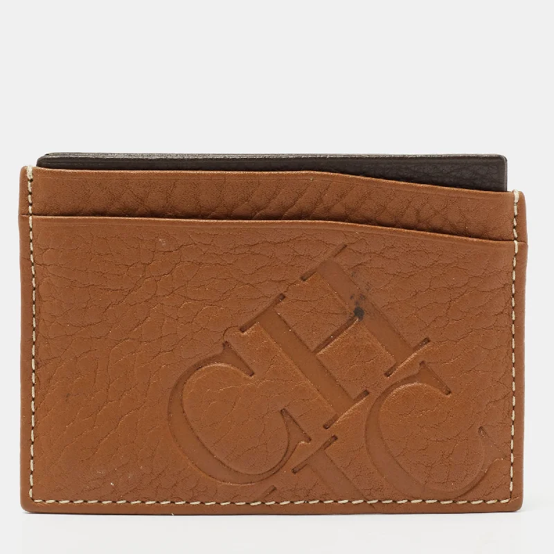Women's money clip with a mirror on the back​Ch Carolina Herrera Tan Monogram Embossed Leather Card Holder