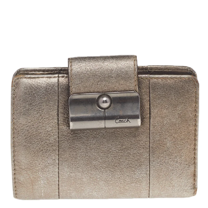 Women's money clip with a zodiac symbol design​Coach Metallic Gold Leather Compact Wallet