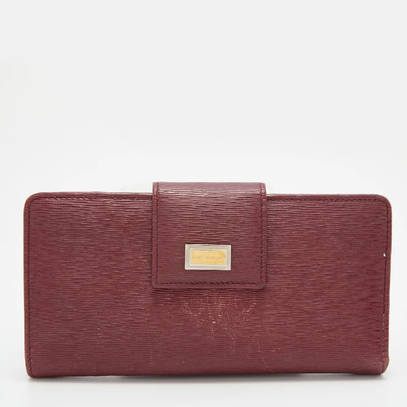 Women's money clip in a metallic sheen finish​Dolce & Gabbana Burgundy Leather Flap Continental Wallet