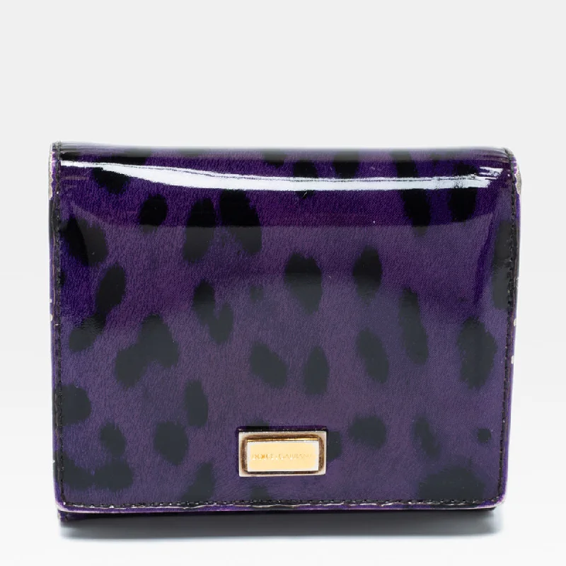 Women's money clip for left - handed usersDolce & Gabbana Purple Leopard Print Patent Leather Trifold Wallet.. Women's money clip for left - handed usersDolce & Gabbana Purple Leopard Print Patent Leather Trifold Wallet..