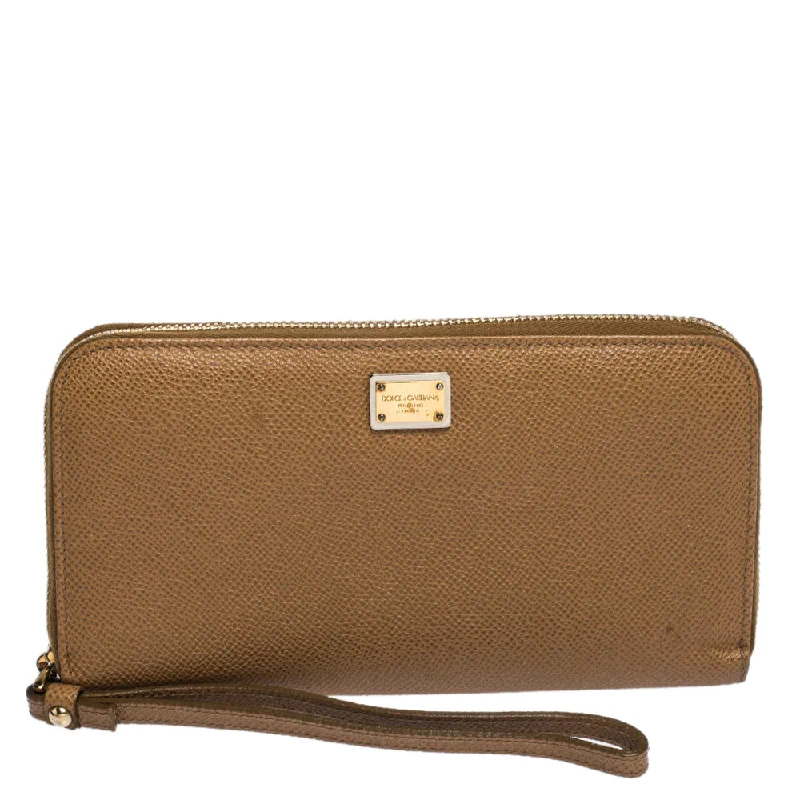 Women's money clip with a tassel for added flairDolce & Gabbana Tan Leather Strappy Zip Around Wallet.. Women's money clip with a tassel for added flairDolce & Gabbana Tan Leather Strappy Zip Around Wallet..