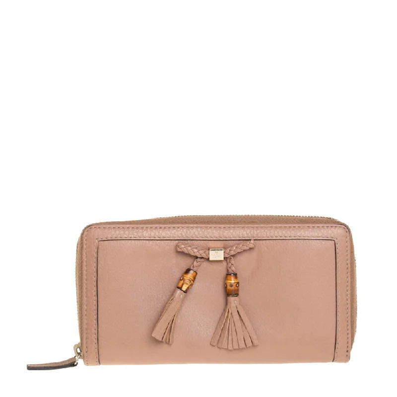 Soft - touch women's money clip for a comfortable grip​Gucci Beige Leather Bamboo Tassel Bow Zip Around Wallet..