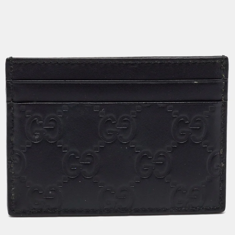 Women's money clip in a pastel color palette​Gucci Black Guccissima Leather Card Holder..