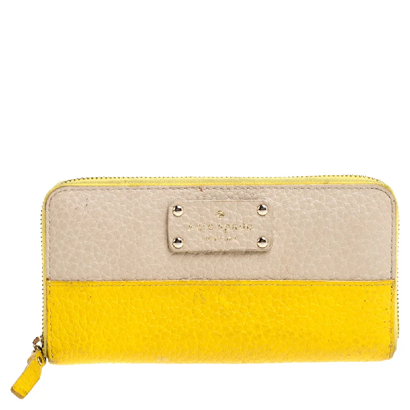 Women's money clip for a statement accessory look​Kate Spade Yellow/beige Leather Grove Court Lacey Zip Around Wallet..