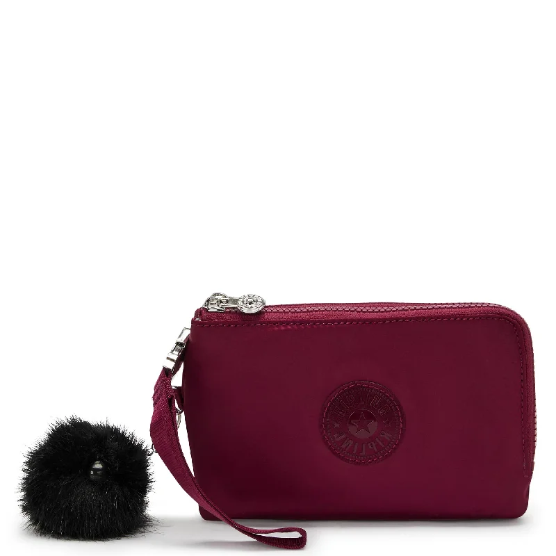 Waterproof women's money clip for beach outings​Kipling Nimita Wristlet Wallet