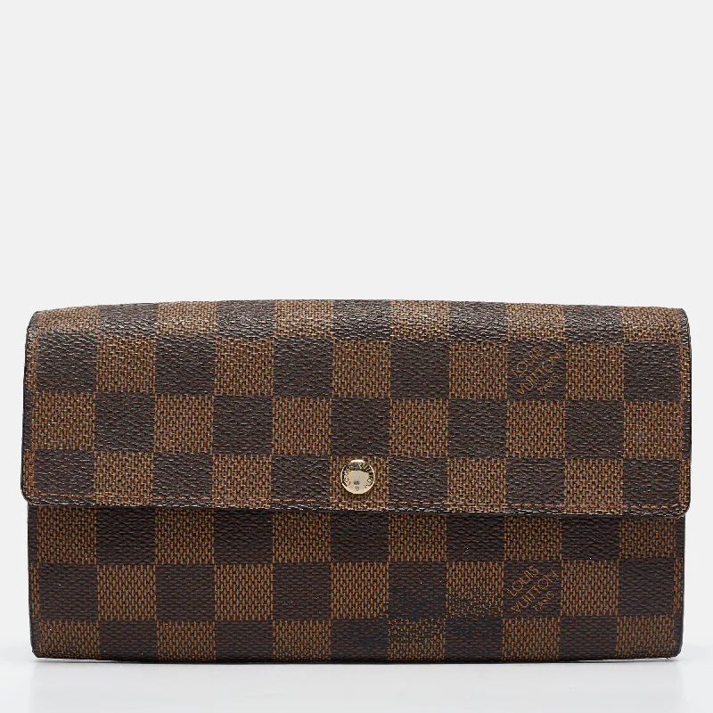 Women's money clip with a mirror on the back​Louis Vuitton Damier Ebene Canvas Sarah Wallet..
