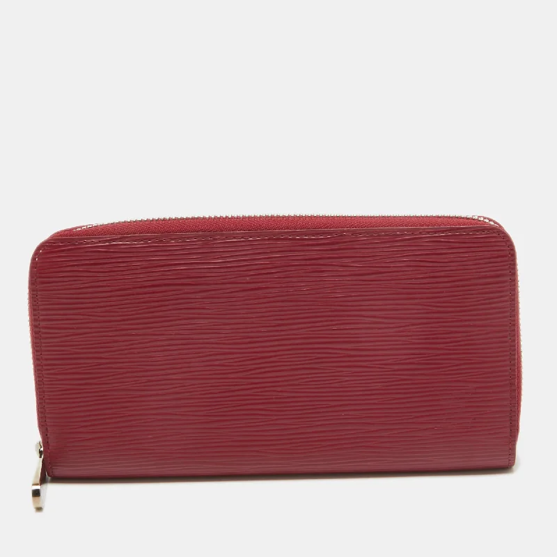 Women's money clip with a scalloped edge​Louis Vuitton Fuchsia Epi Leather Zippy Wallet..