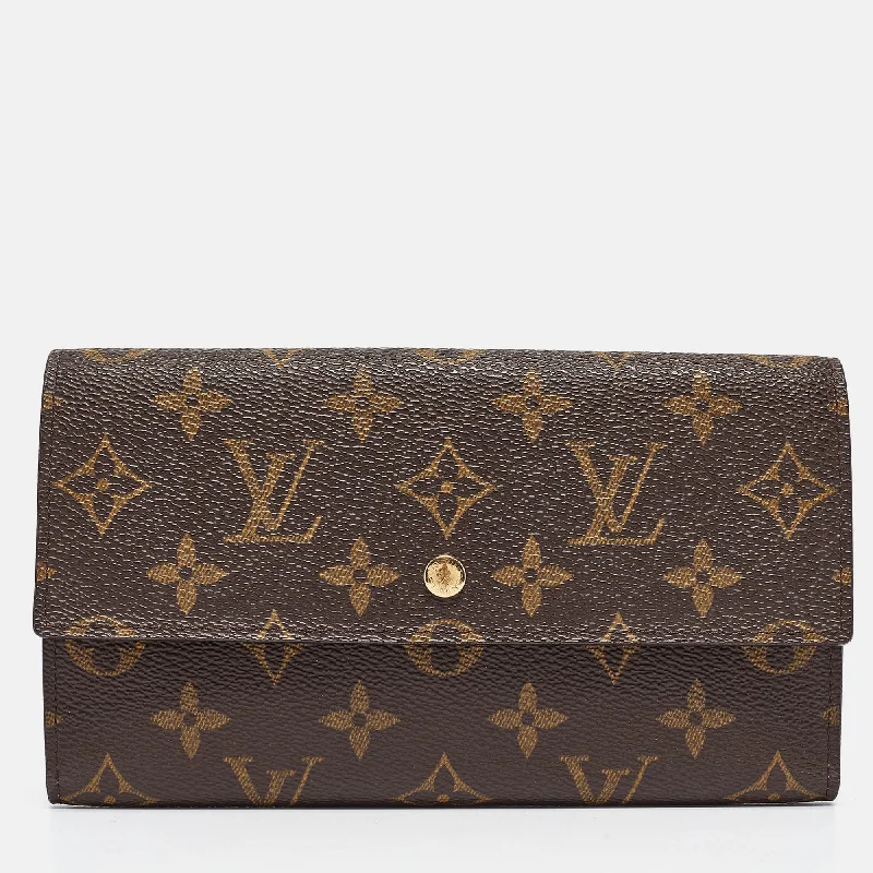 Women's money clip with a tassel for added flair​Louis Vuitton Monogram Canvas Porte-Tresor International Wallet