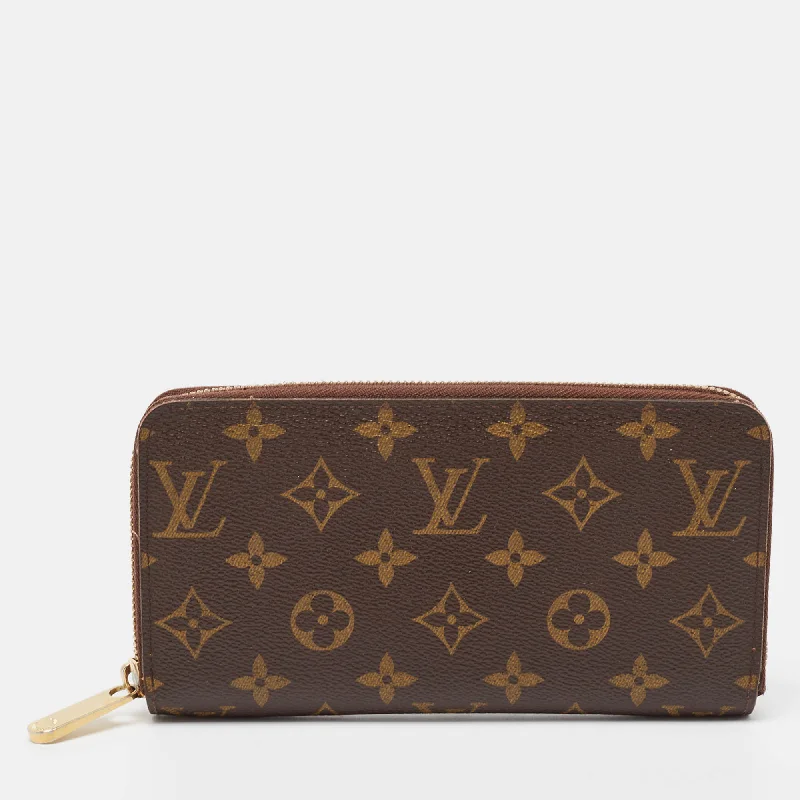 Women's money clip with a swarovski crystal accent​Louis Vuitton Monogram Canvas Zippy Wallet..