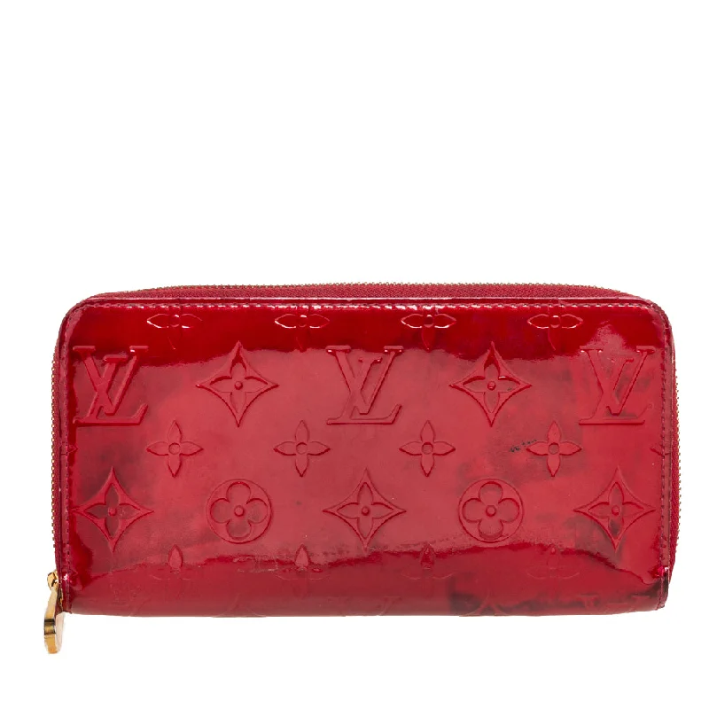 Women's money clip with a tassel for added flair​Louis Vuitton Pomme D’amour Monogram Vernis Zippy Wallet..