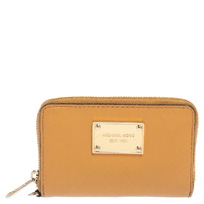 Women's money clip for a sporty - chic outfit​Michael Kors Tan Leather Zip Around Wristlet Wallet.