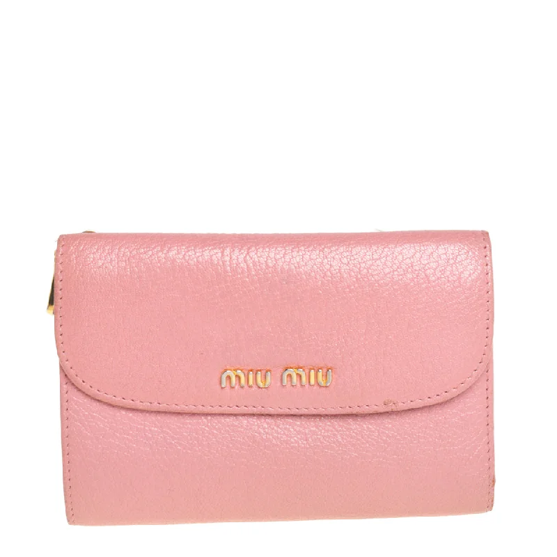 Colorful women's money clip for a pop of style​Miu Miu Pink Leather Madras Compact Wallet..
