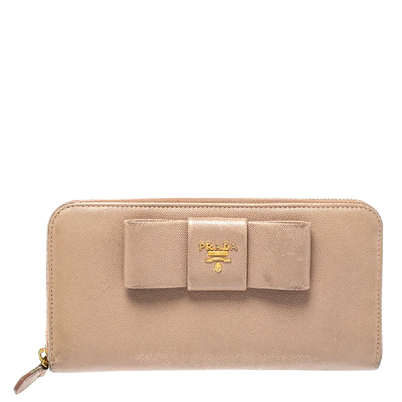 Women's money clip for a back - to - school accessory​Prada Beige Saffiano Leather Bow Zip Around Wallet..