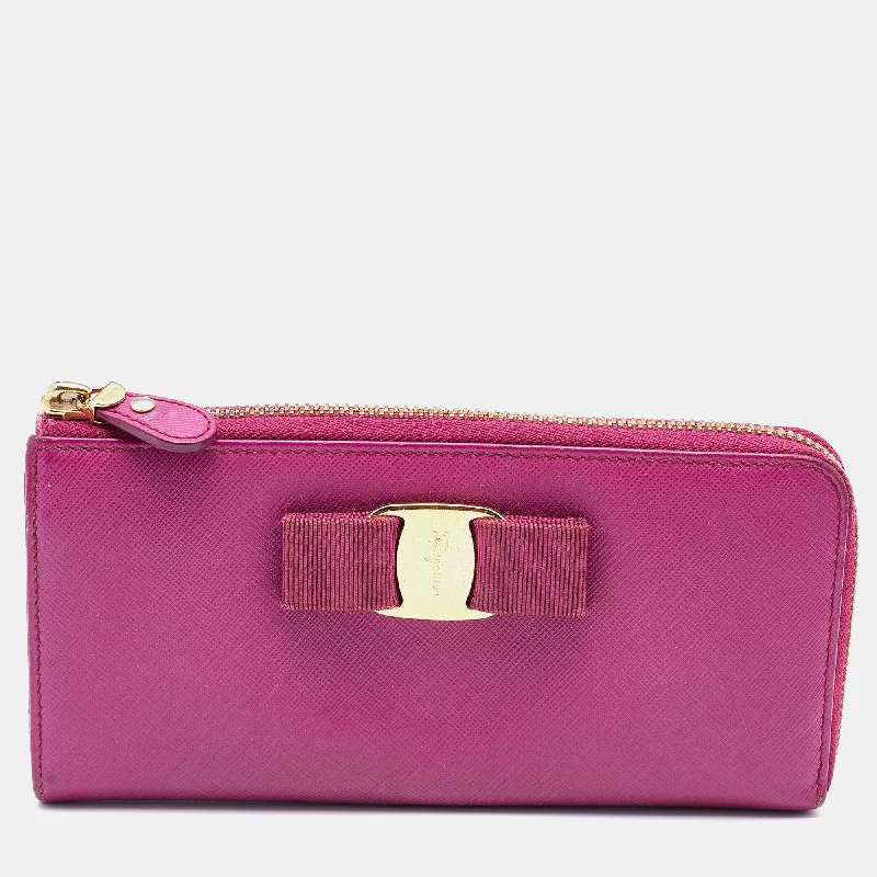 Women's money clip in gold - tone metal​Salvatore Ferragamo Pink Saffiano Leather Vara Bow Zip Continental Wallet