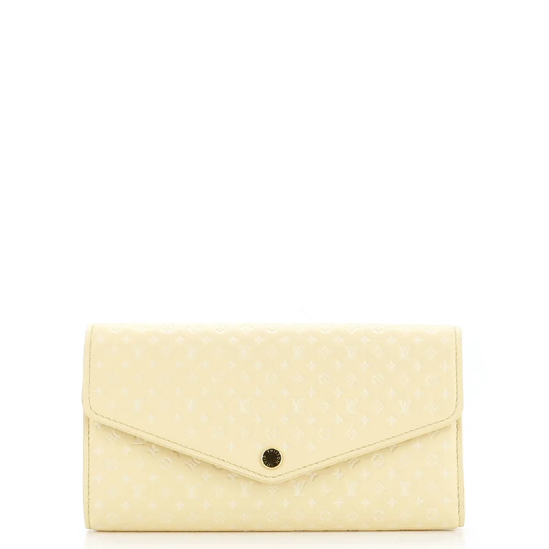 Women's money clip with a braided leather strap​Sarah Wallet NM Nanogram Embossed Leather