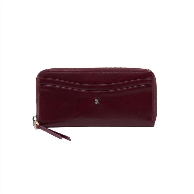 Women's money clip in a metallic sheen finish​Women's Max Large Zip Around Wallet In Merlot