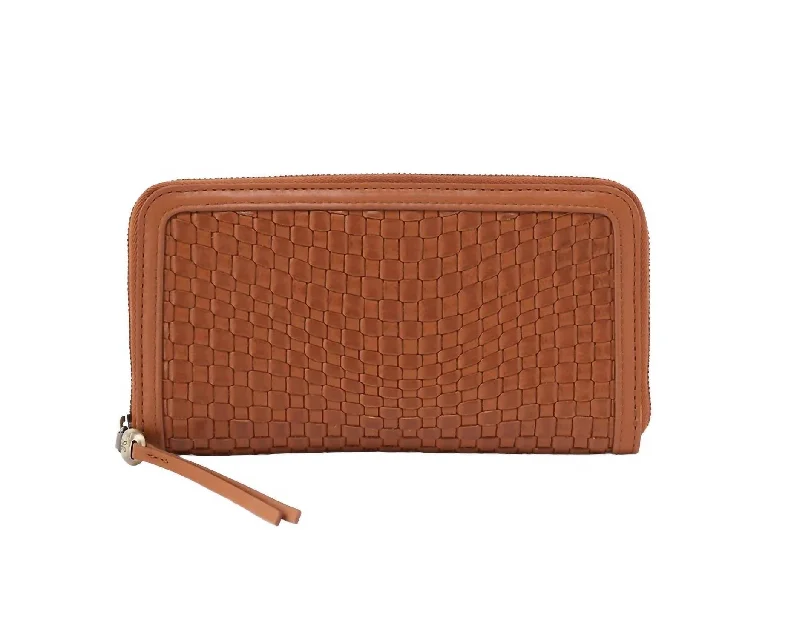 Women's money clip with a tassel for added flair​Women's Nila Large Zip Around Wallet In Wheat