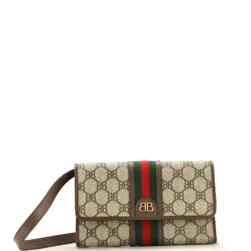 Women's money clip for a statement accessory look​x Gucci The Hacker Wallet on Strap BB Coated Canvas