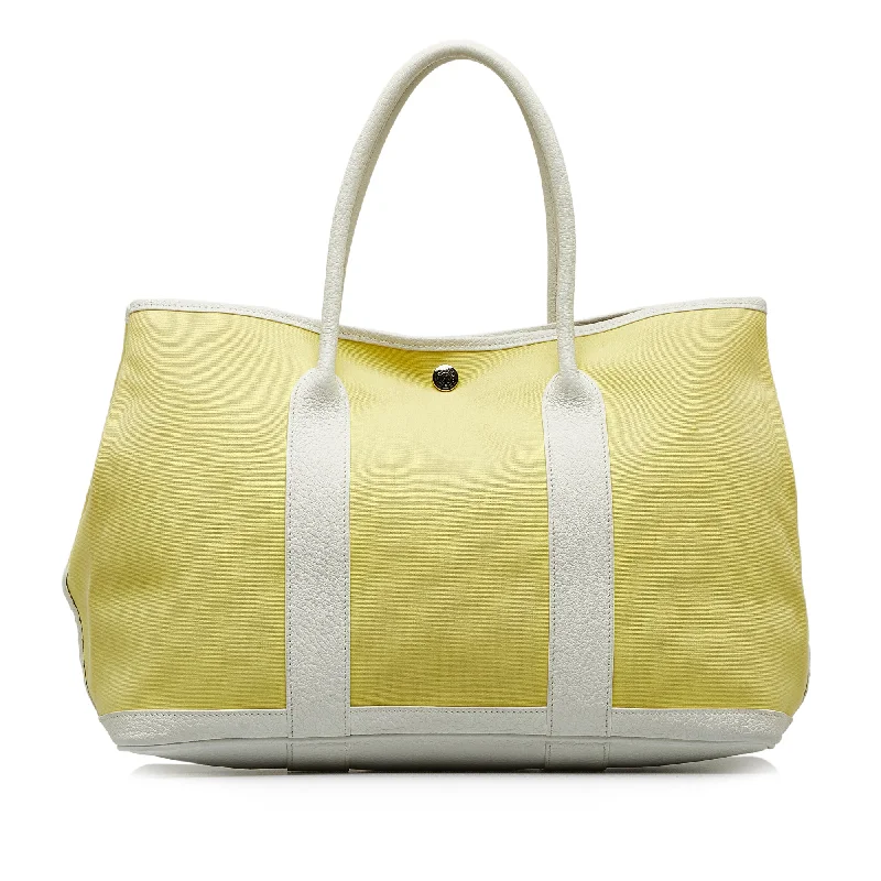Medium - Sized Canvas Tote Bag in Navy Blue with Striped Pattern for a Nautical - Inspired LookYellow Hermès Toile Garden Party TPM Tote Bag