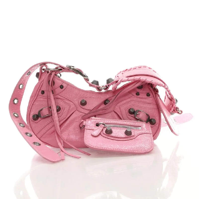 Suede Shoulder Bag in Pink with Tassel Accents for Casual OutingsBalenciaga Le Cagole XS